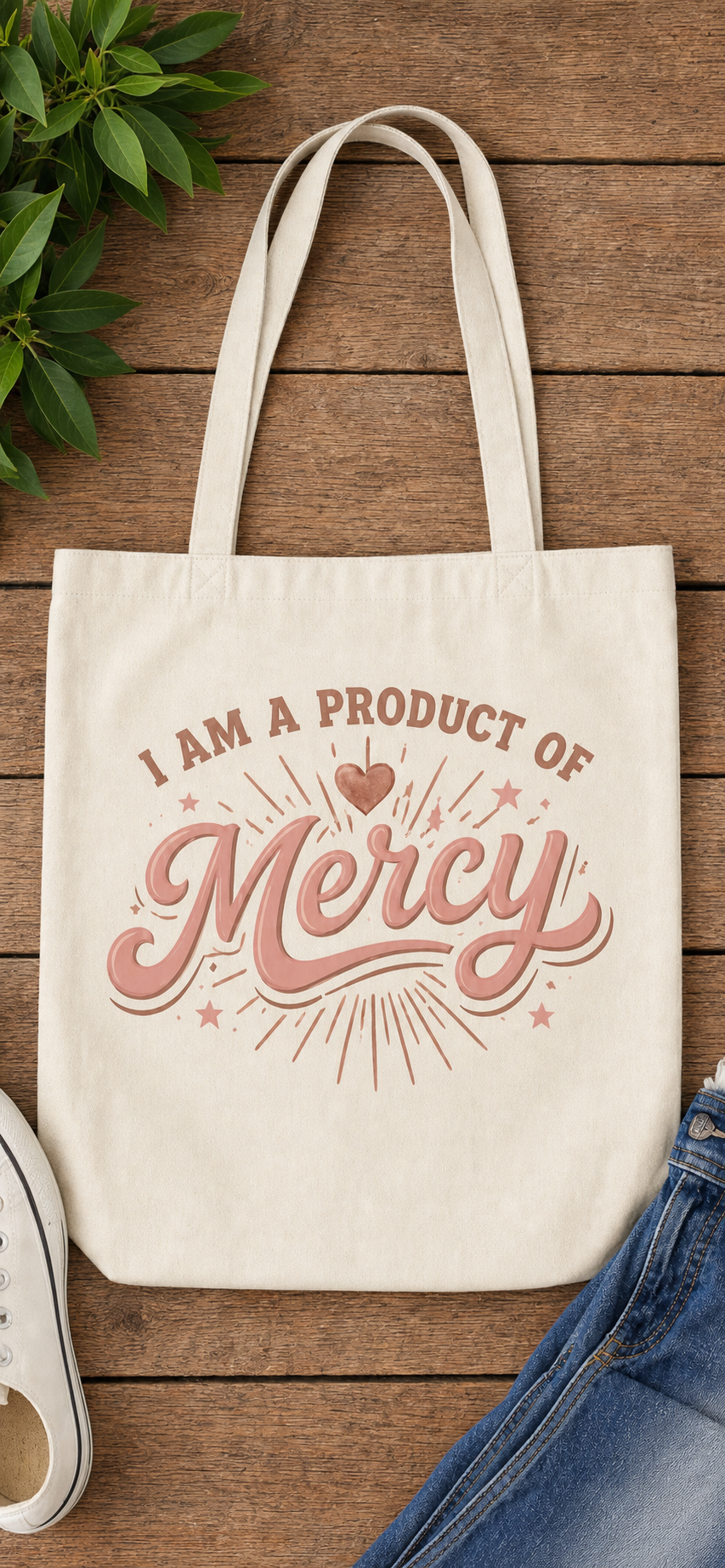 I Am a Product of Mercy canvas tote in rose gold, flat lay